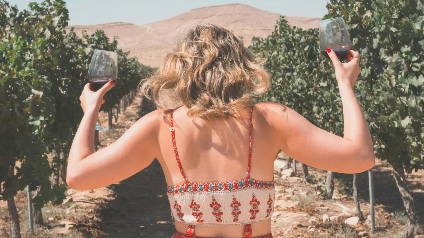 girl holding wine